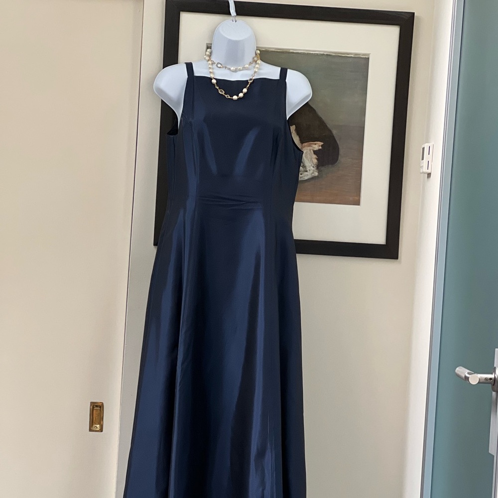 Long princess dress in metalic dark blue silk with underskirt. Very pretty.